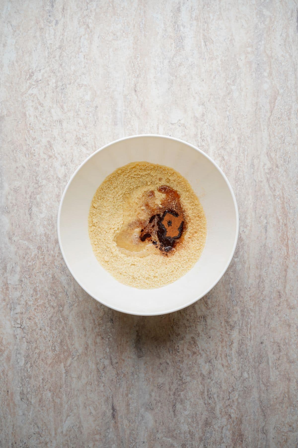 Delicious vanilla pudding topped with caramel syrup in a white bowl.