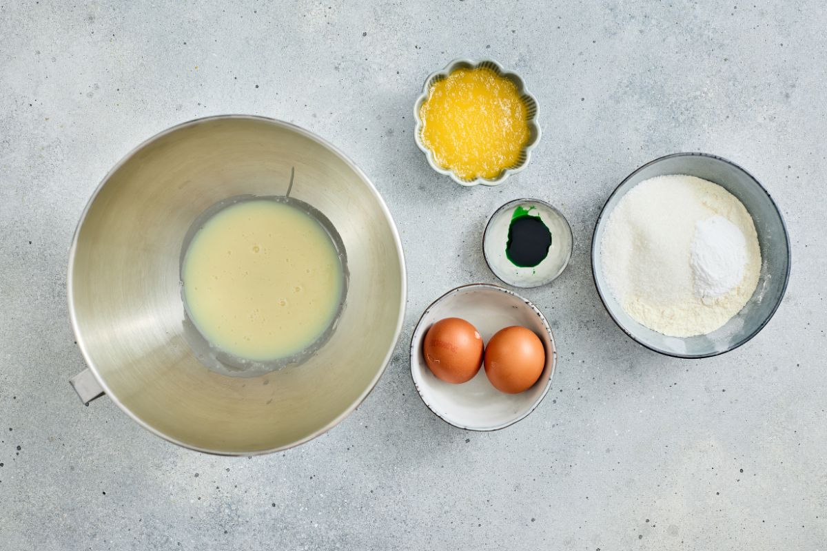 Brightly lit image showing eggs, flour, and butter for baking.