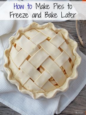 Unbaked apple pie with a woven lattice crust in a glass pie dish, on a white kitchen towel.