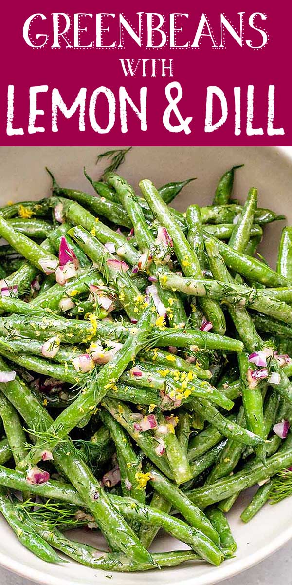 Bowl of green beans with chopped red onion, lemon zest, and dill
