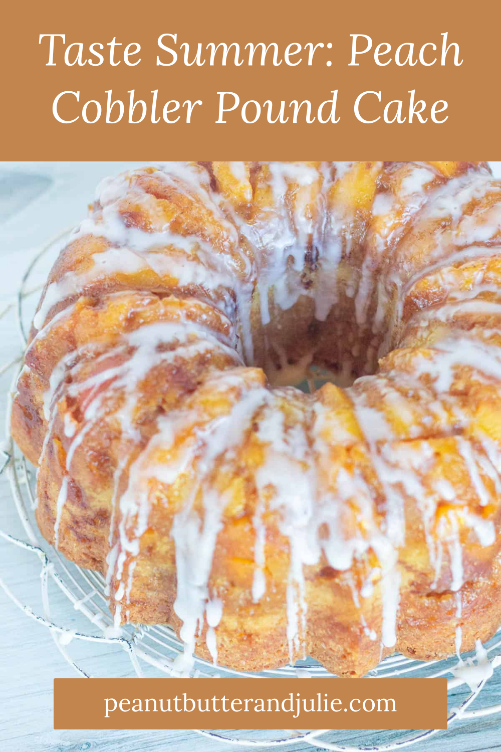 Bundt cake drizzled with white icing, resting on a wire cooling rack.