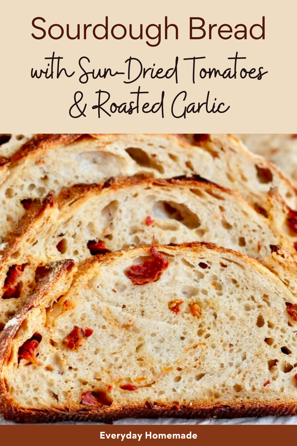 Close up of several slices of sourdough bread with visible pieces of sun-dried tomato and roasted garlic baked into the…