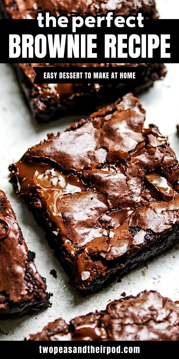Close-up of three fudgy brownies with melty chocolate chips and a crackled surface, on a light background