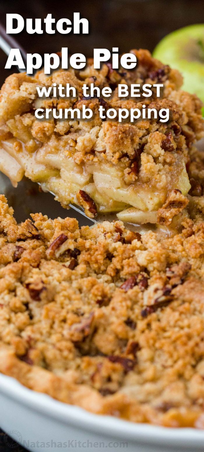 Close-up of a serving of Dutch apple pie being lifted from a pie dish, showing the crumble topping and apple filling.