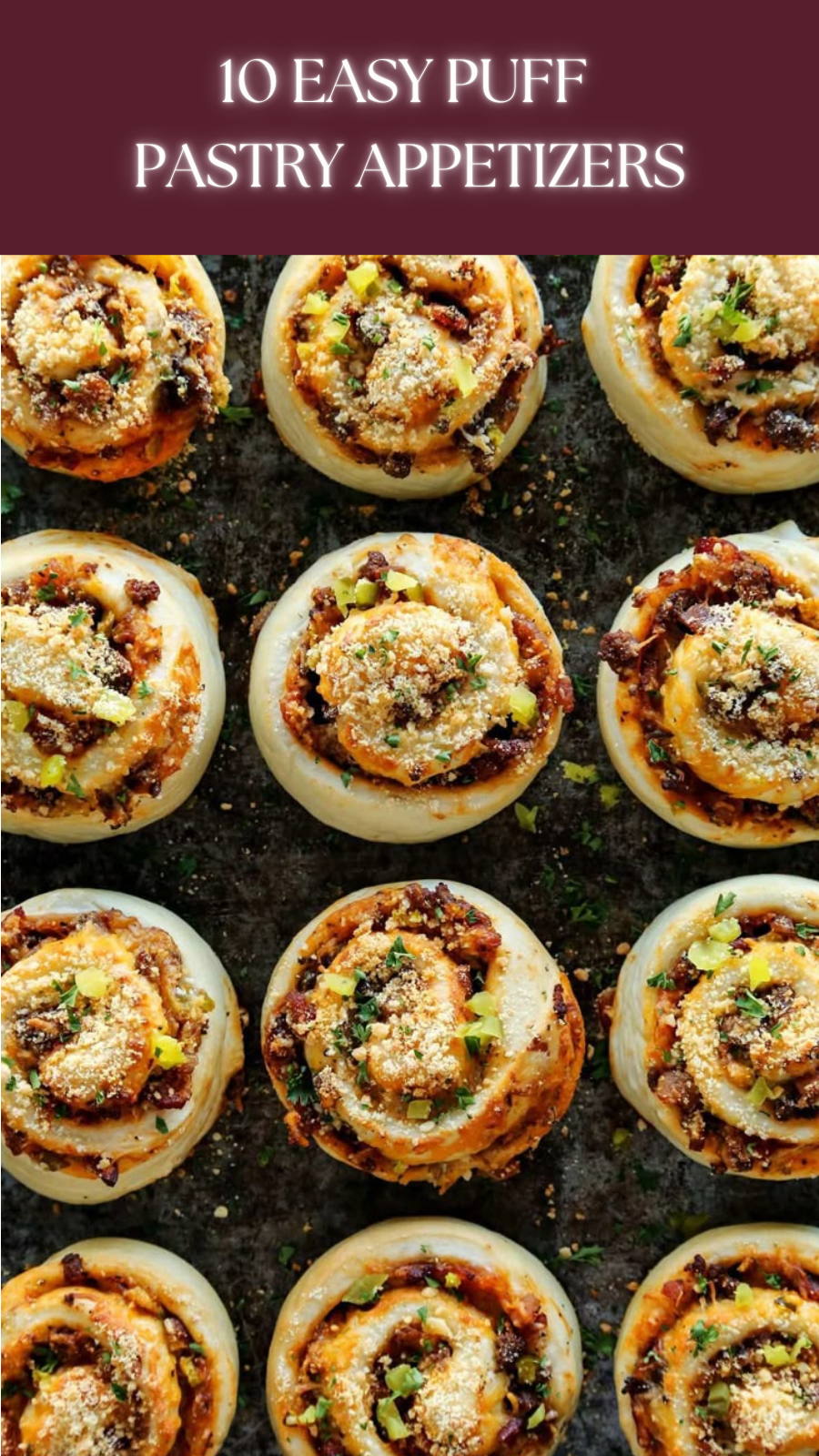 Baked savory pinwheels, garnished with herbs and cheese, arranged on a dark surface