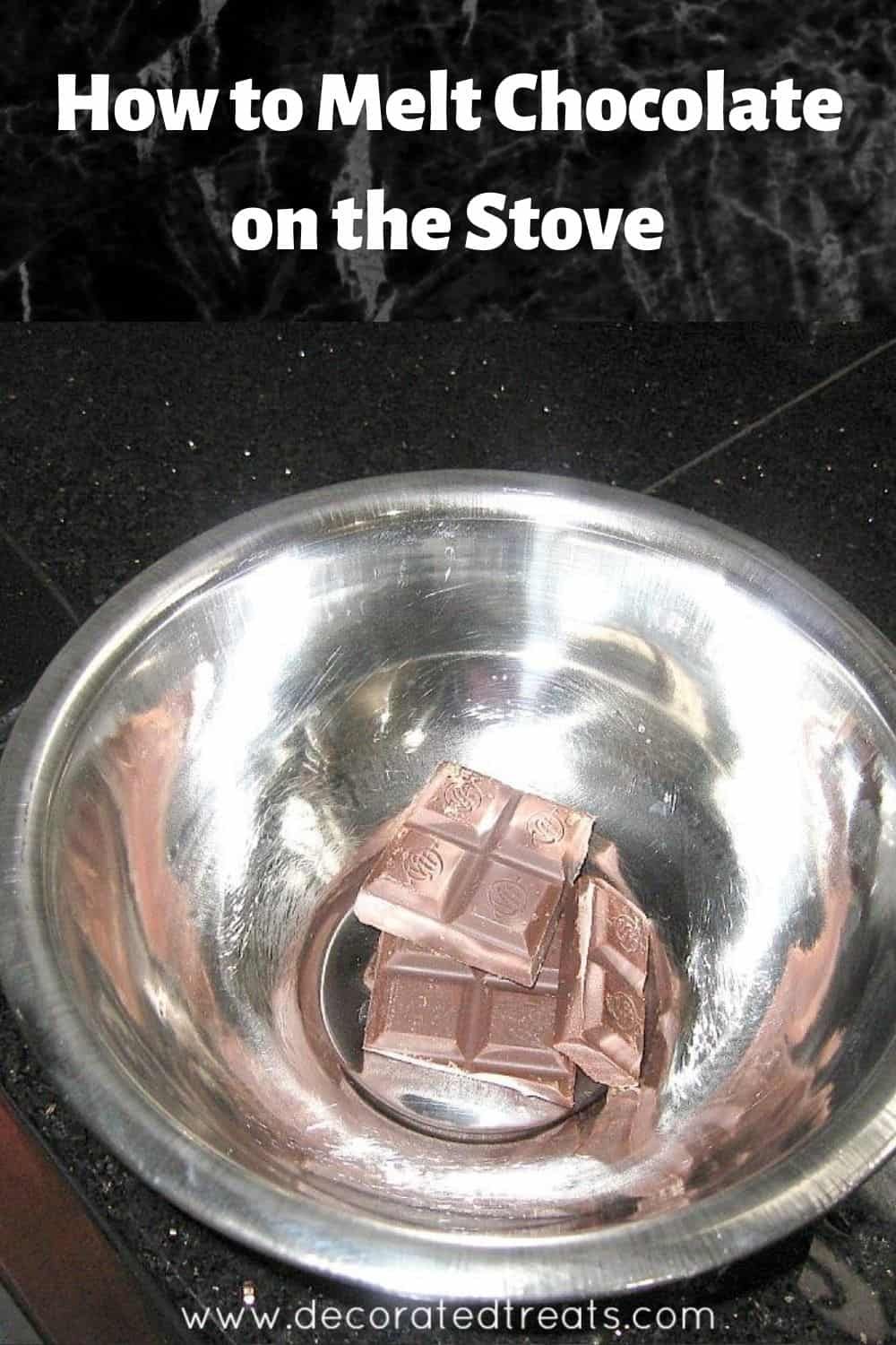 Close-up of chocolate squares in a stainless steel bowl, on a dark countertop.