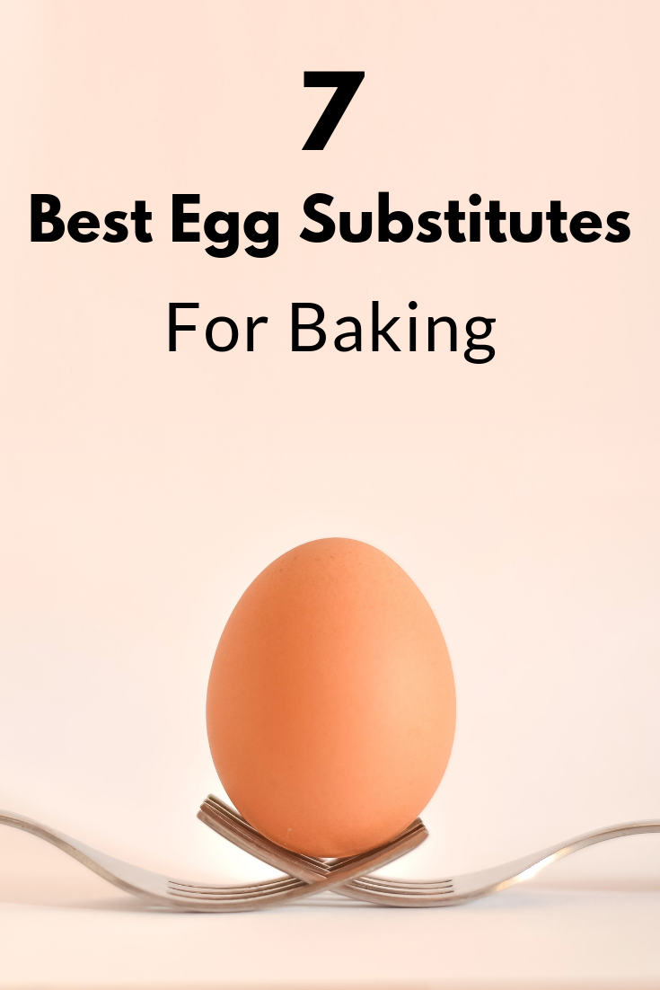 Single brown egg balanced on two crossed forks
