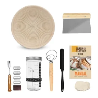 Stainless steel mixing bowl filled with baking tools and a gift tag