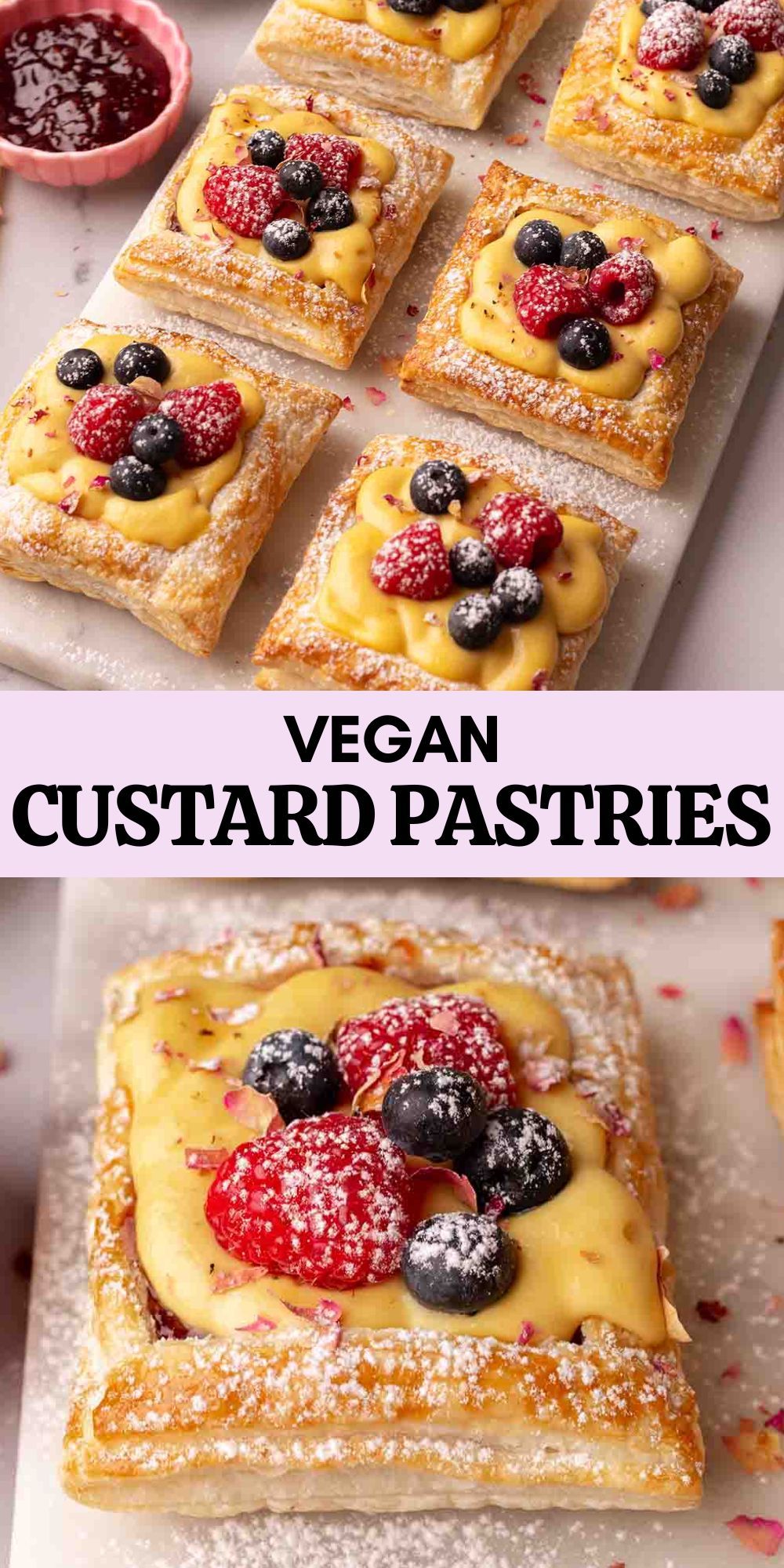 Several square vegan custard pastries, topped with raspberries and blueberries, dusted with powdered sugar, on a white…