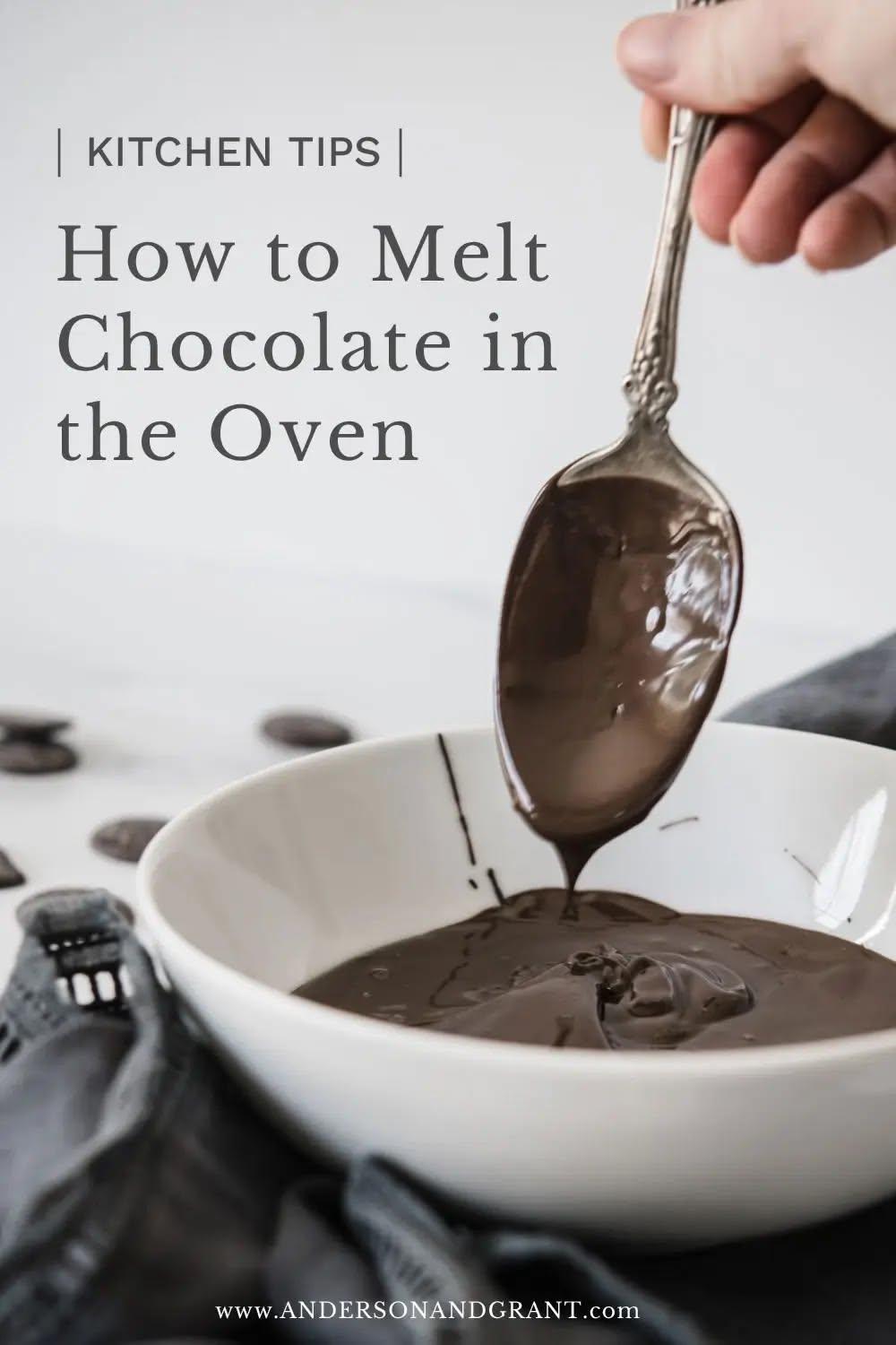 Spoon dripping melted chocolate into a white bowl with chocolate disks scattered nearby