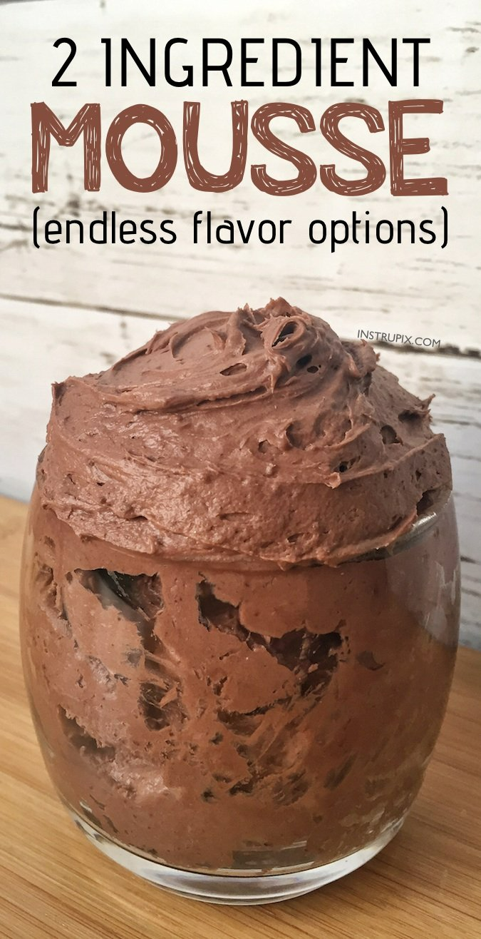 Chocolate mousse in a clear glass on a wooden surface